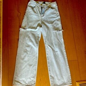Light wash wide leg jeans with side cut outs